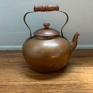 Vintage copper tea kettle with wooden handle